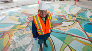 Alex Janvier stands with Photo by: Jeff Nash / Edmonton Oilers